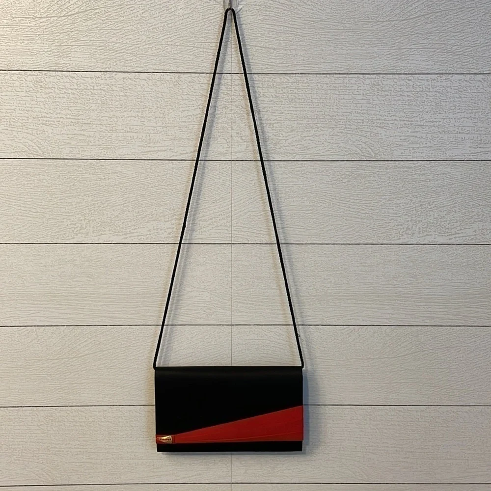 Black and red retro 80's or 90's vintage women's purse with magnetic clasp party